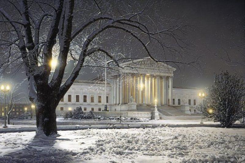 A picture of the Supreme Court amid a snowy background