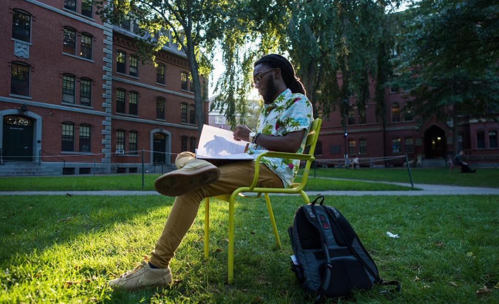 Student studying in Harvard Yard