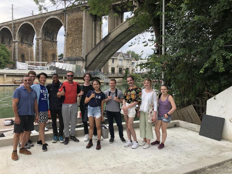 Class photo by the Seine River with Olivier, a former French Olympian