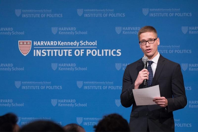A student speaking to an audience at the Institute of Politics