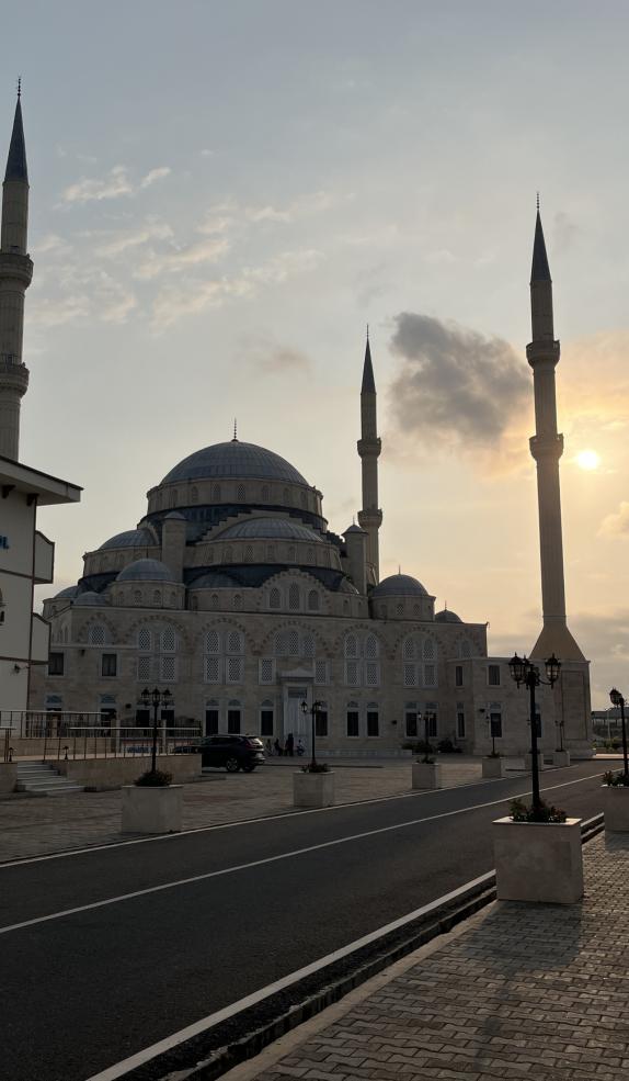 photograph of a mosque in the sunset