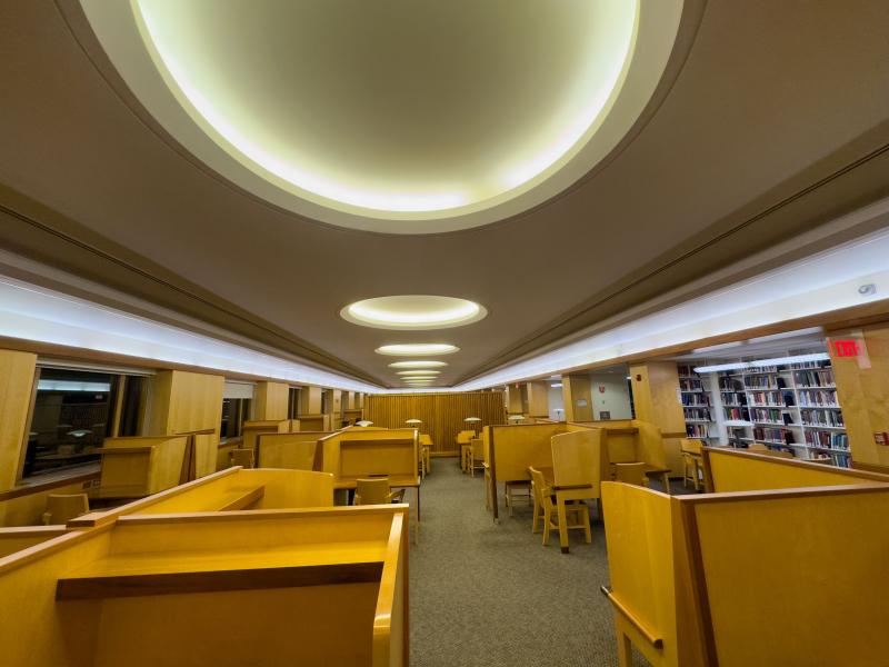 Booths with chairs and tables in Lamont Library
