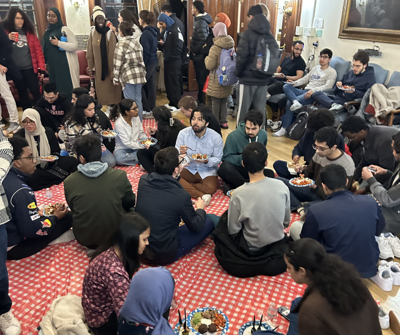 Students eating iftar at the Phillips Brooks House