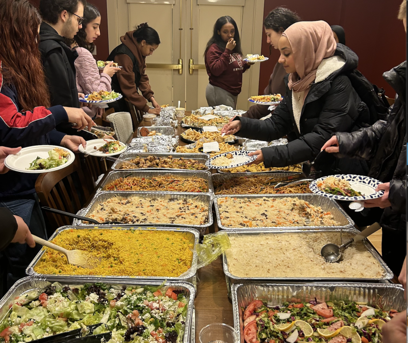 Students grabbing food for Iftar.