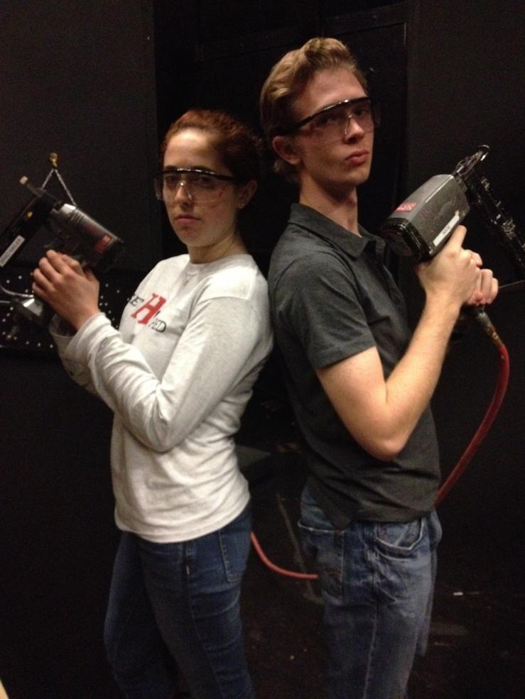 Picture of two students holding power tools