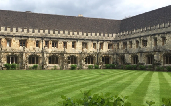 Manicured lawn in front of an old building