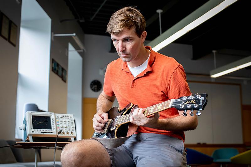  Robert Wood takes his guitar for a spin in preparation for his new course which combines engineering with music.