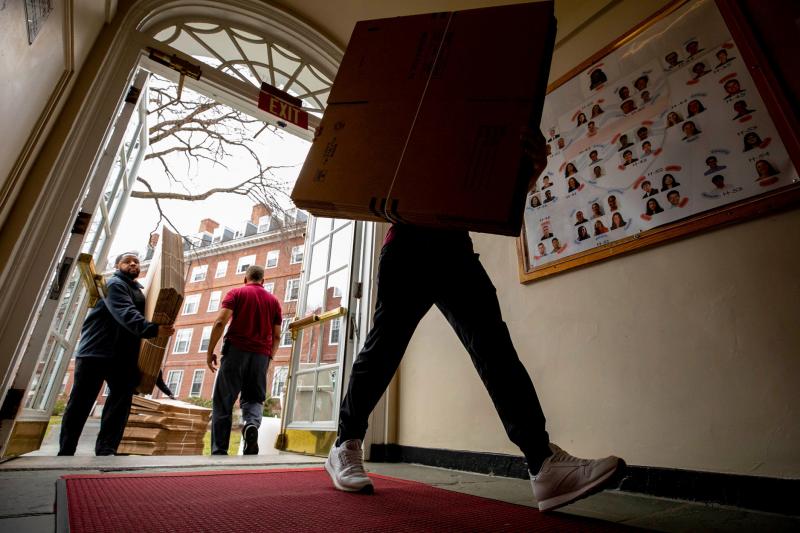 Packing boxes move in as students pack up to move out of Eliot House.