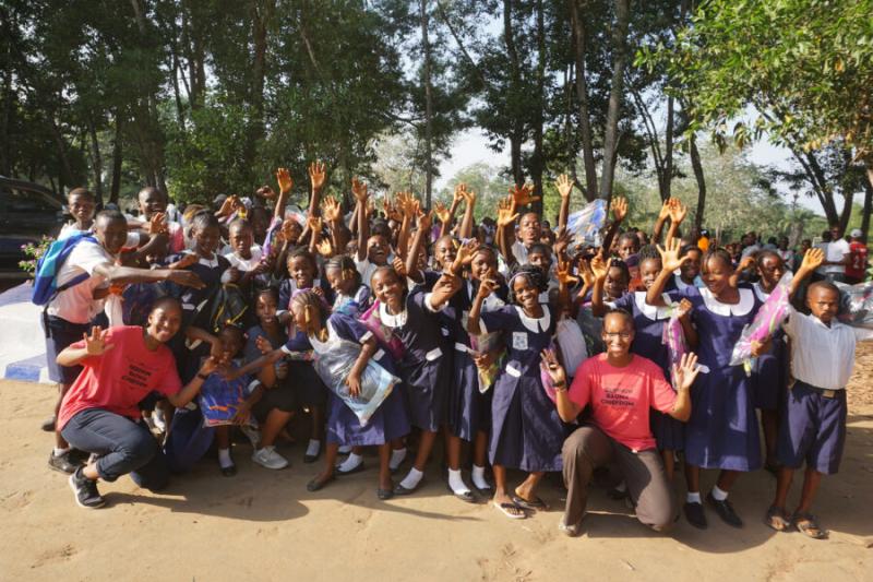 This past December, twins Suuba (far left) and Sadia Demby (far right) donated 480 backpacks and three laptops to their father’s ancestral village, Gerihun, in Sierra Leone.