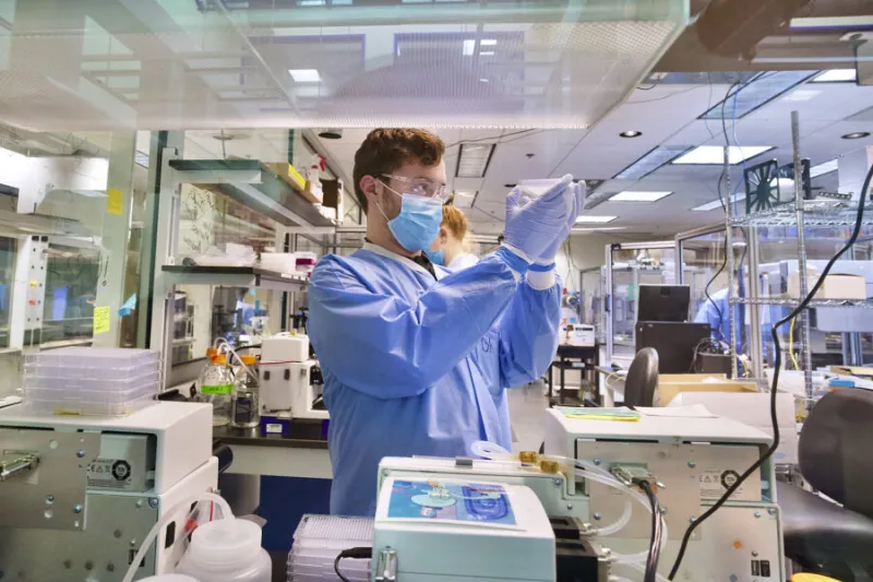 Daniel Roberts, an accessioning technician at the Broad Institute, conducts COVID-19 screening.