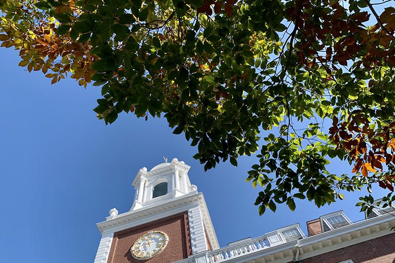 Looking up at the Lowell House clock tower.