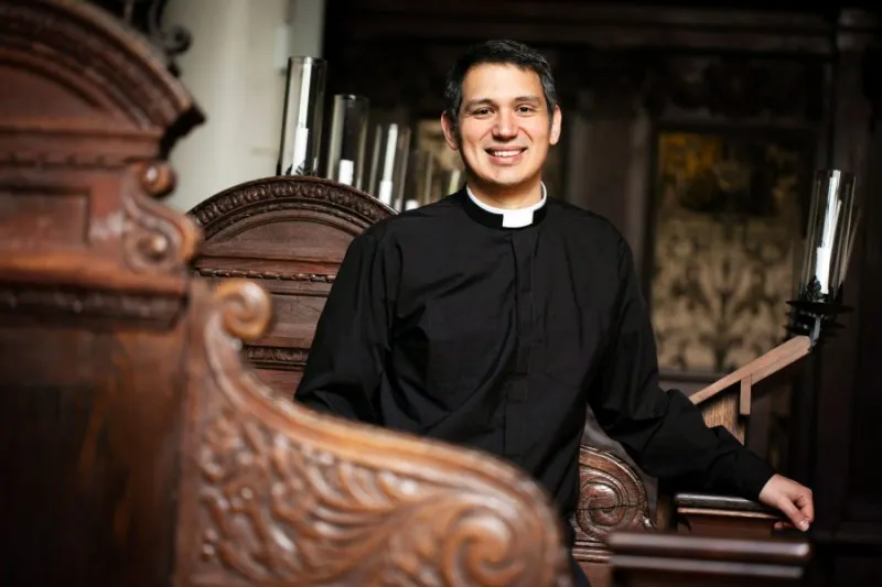 Professor of religious studies and literature is also Episcopal minister.