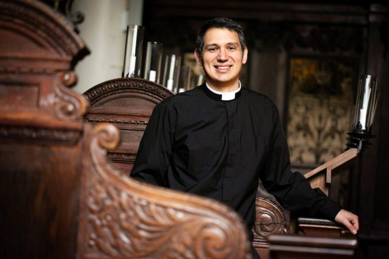 Professor of religious studies and literature is also Episcopal minister.