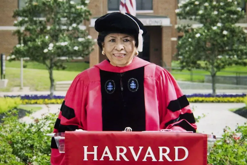 Ruth Simmons in  Harvard Graduation Regalia  at a podium during her Graduation speech to the class of 2021