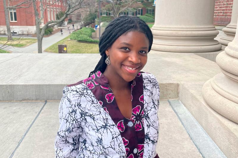 Juliet standing on Widener Library steps