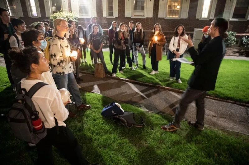 Outside Kirkland House, Lowell Brower (right) meets with students from his “Supernatural Storytelling” course. The students are headed to Kirkland's library to ask the resident spirit a few questions.