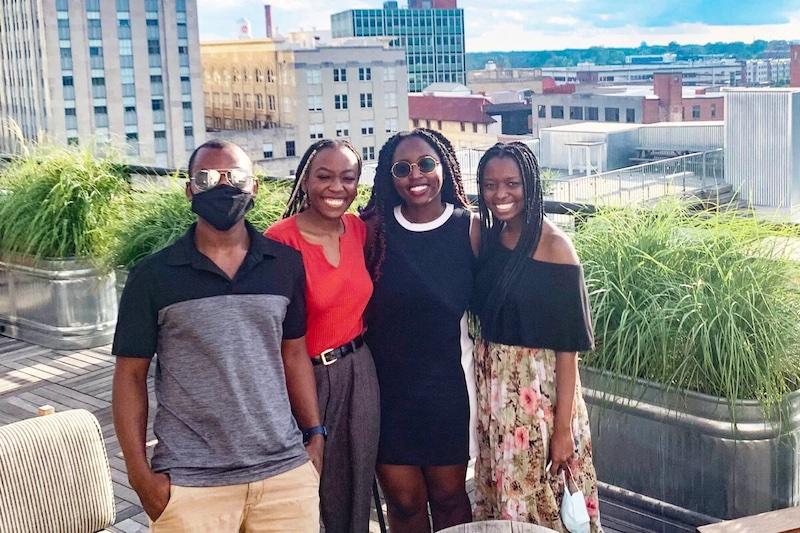 Harvard senior Anastasia Onyango (far right) with siblings (from left) Jesse, Sheila, and Brenda at a rooftop restaurant in North Carolina.
