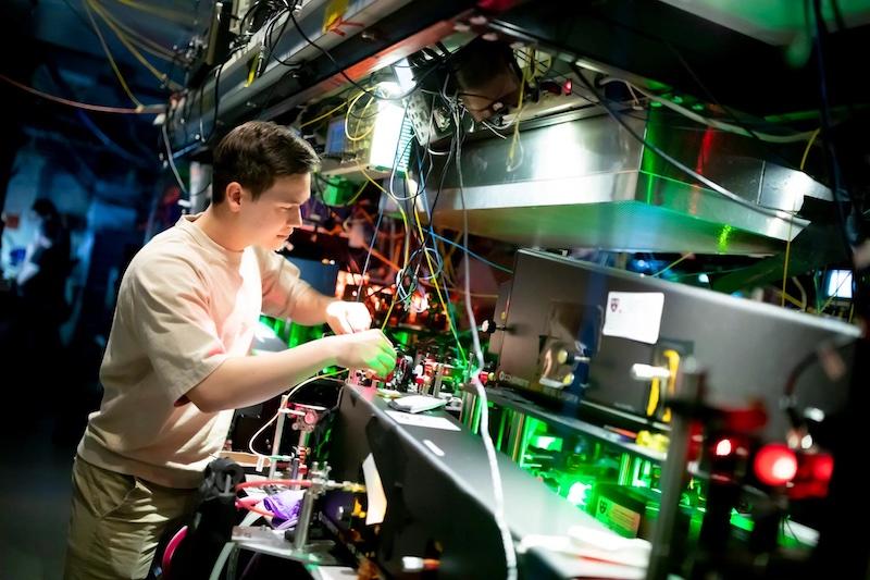 Andrew Winnicki, a rising senior studying physics and math, works with lasers in the Doyle Lab.