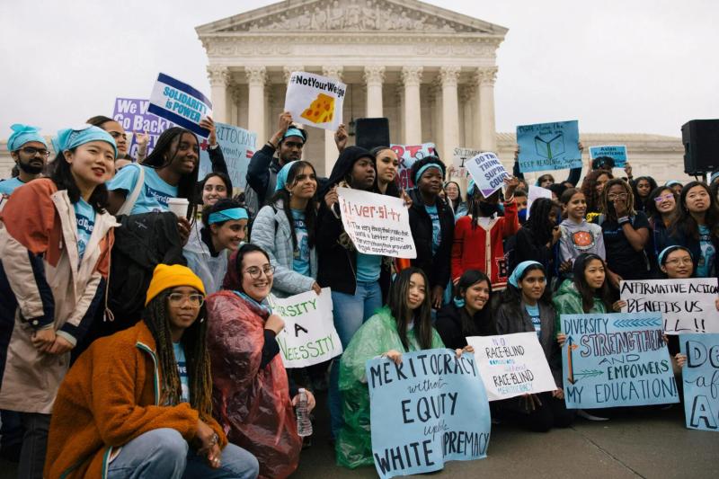 Harvard students rally outside the Supreme Court with "Defend Diversity" Posters