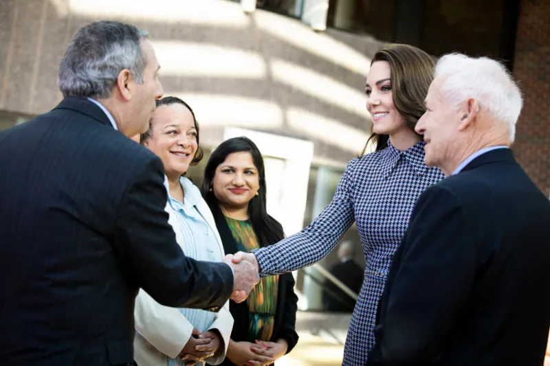 The Princess of Wales shakes hands with Harvard President Larry Bacow (from left), Dean Bridget Long, Cambridge Mayor Sumbul Siddiqui, and Jack Shonkoff, director of the Center for the Developing Child.