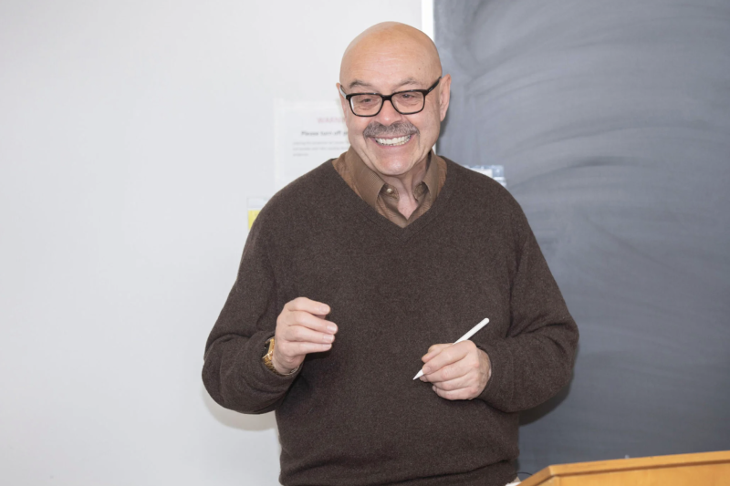Sociology Professor Chris Winship gives lecture at blackboard
