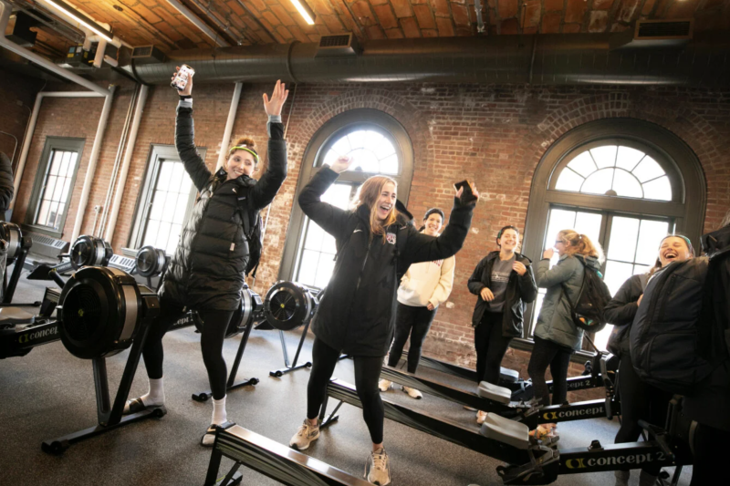 Members of the women's rowing teams test out the new sound system and some dance moves in the newly renovated Weld Boathouse.