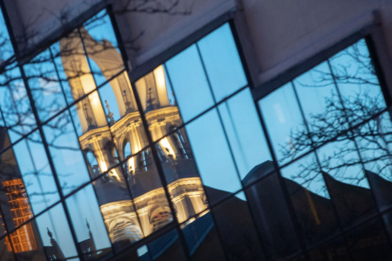 Memorial Church is reflected in the windows of the Graduate School of Design’s Gund Hall. 