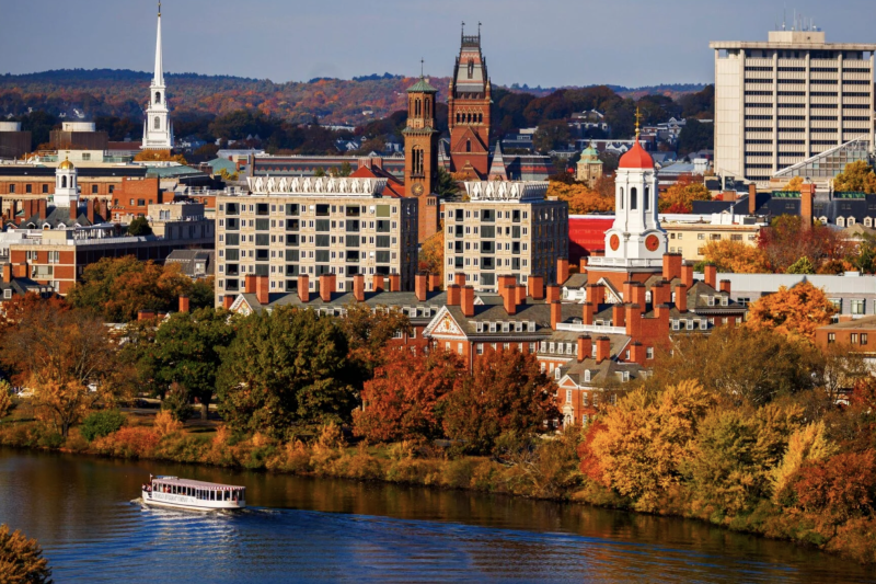 Fall foliage adds dazzling color to the view of campus from across the Charles River.