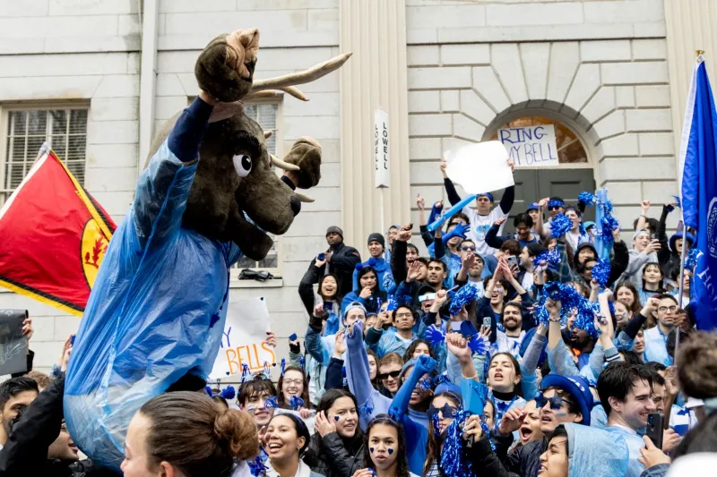 Lowell House students cheer for their House on the steps of University Hall in Harvard Yard on Housing Day.