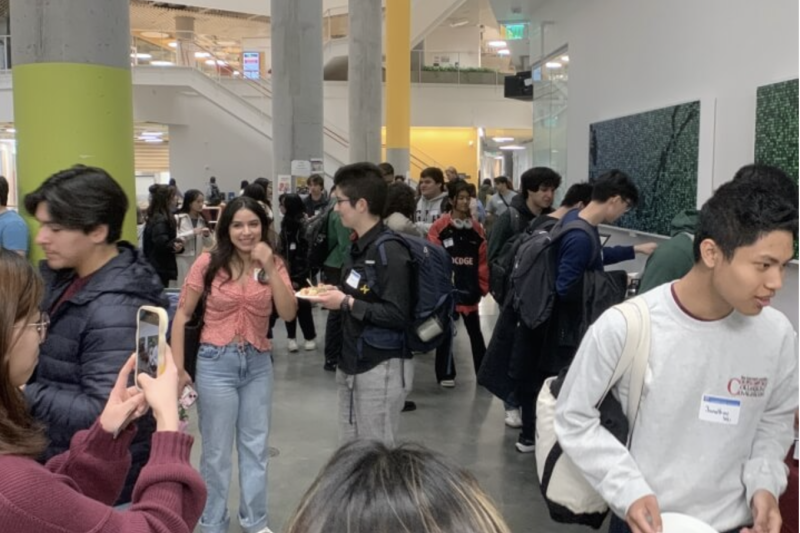 Students congregate inside meeting hall 