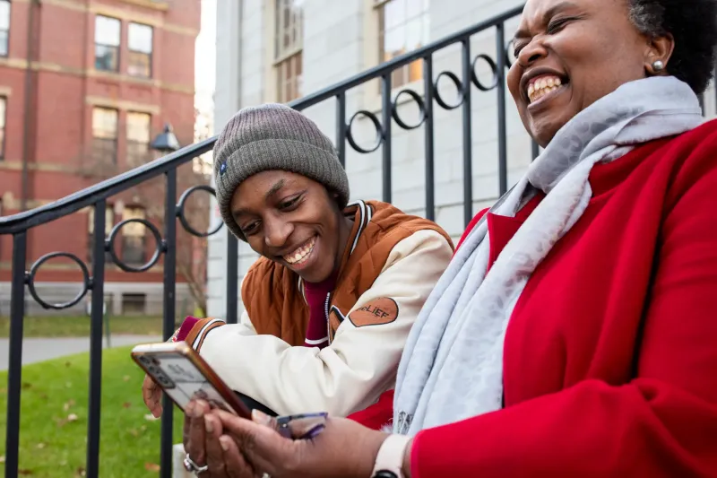 First-year Emmanuel Muriuki (left) and Sheila Thimba, dean of administration and finance.
