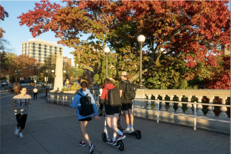 Students walk across the Weeks Bridge, which connects Harvard’s Cambridge and Allston campuses.