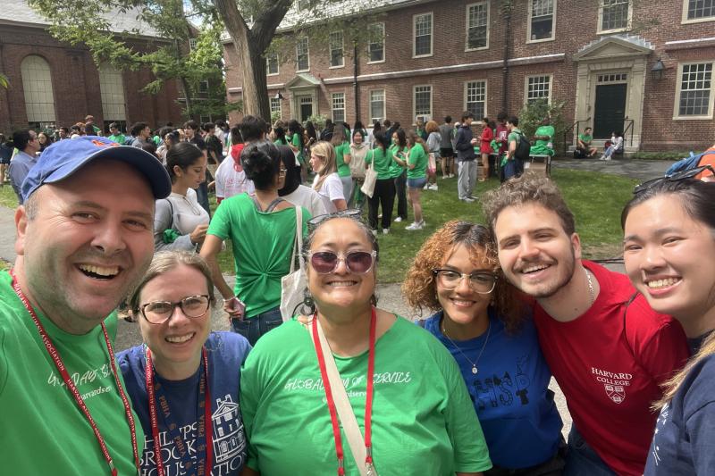 A group of staff and students taking a selfie before the day of service begins.