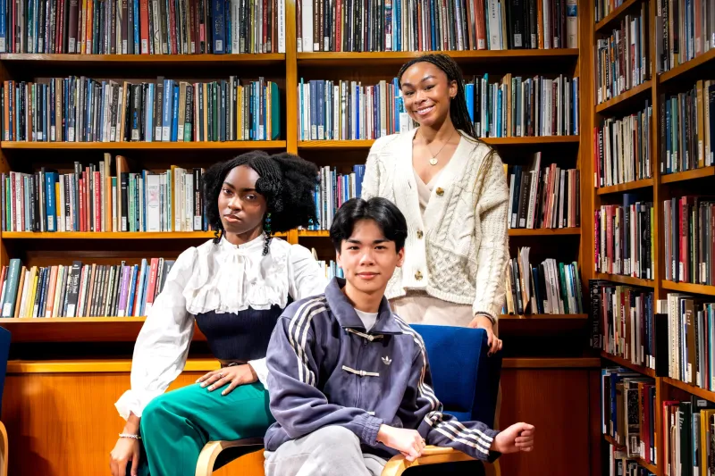 The three student poet laureates (from left to right): Salome, Evan, and Alyssa, inside the Lamont Poetry Room.