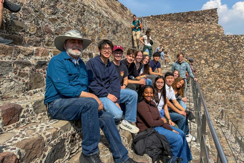 Professors and students sitting at the Pyramid at the Sun in Mexico.