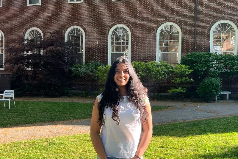 Oneli Perera outside on the Harvard campus.