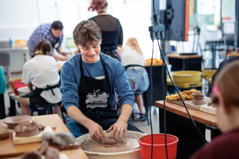 Beau Chiasson ’30 at a wheel throwing workshop at the Harvard Ceramics Program in Allston.