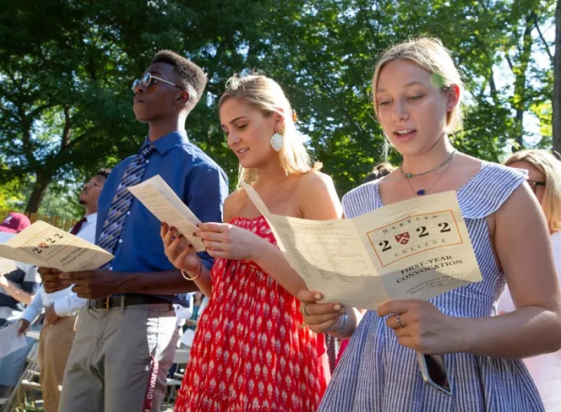 students with programs during convocation