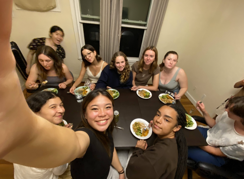 Erika and friends gathered around a table having a meal