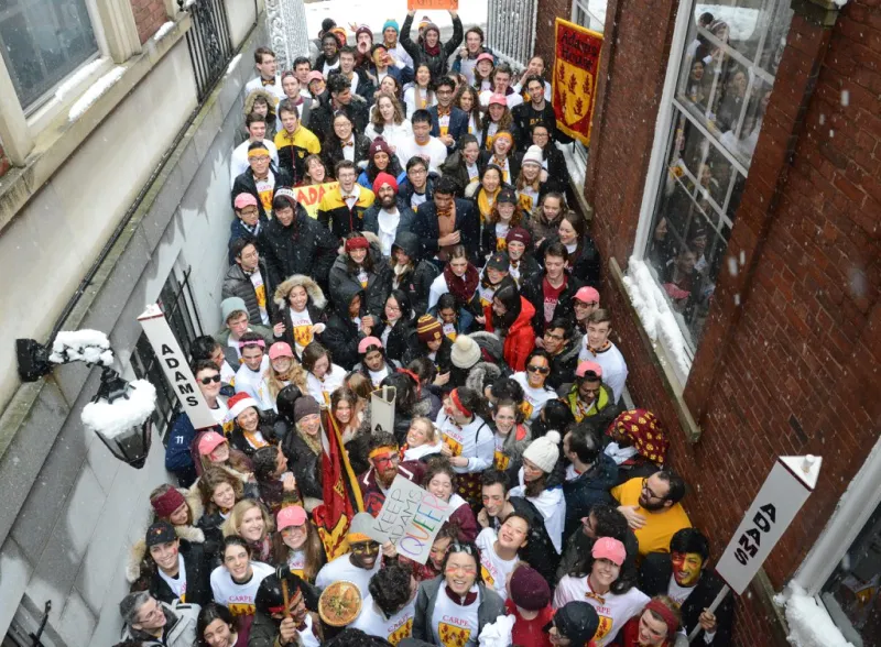 Crowd of students parading for Adams House