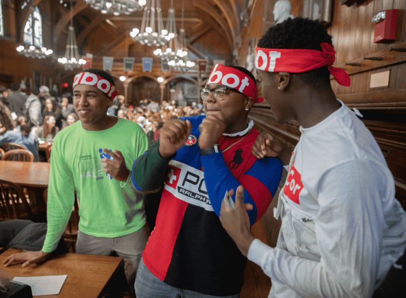 Students in Annenberg dining hall post-Housing Day dorm storms with a like icon in the bottom righ-hand corner.