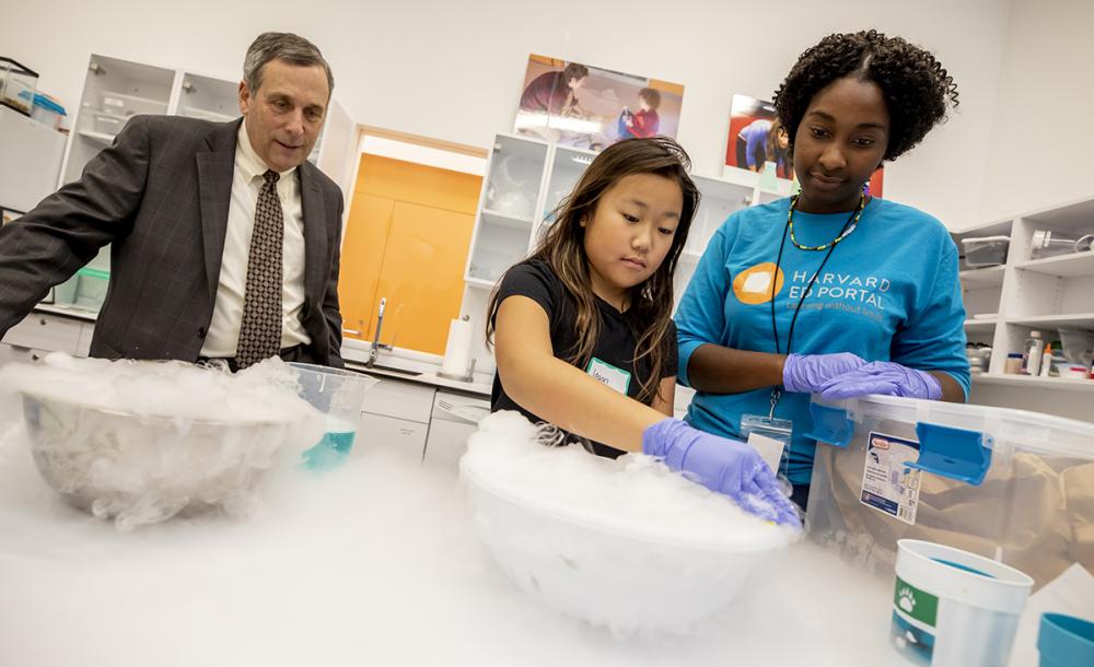 President Bacow and a student at the Ed Portal