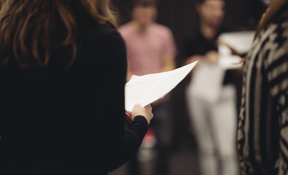 Close up of student holding a piece of paper