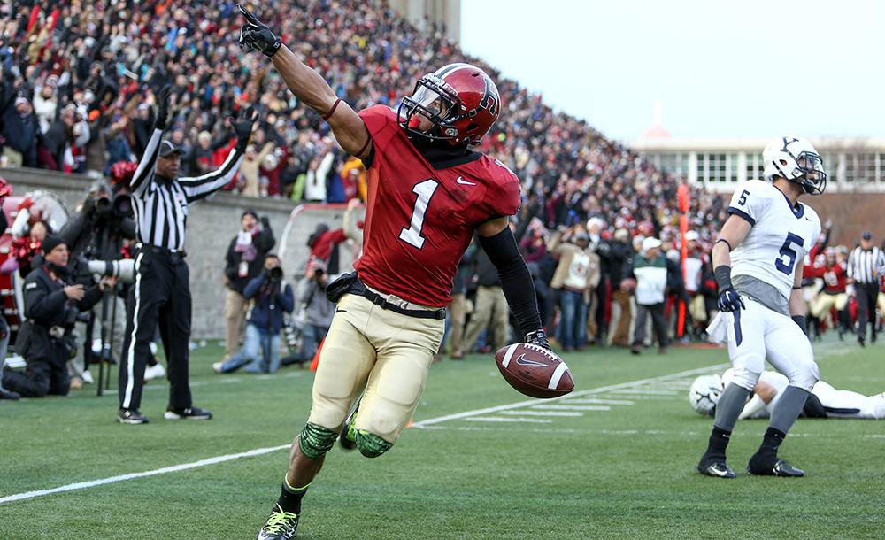 Harvard Football player on the field during the Harvard and Yale Game