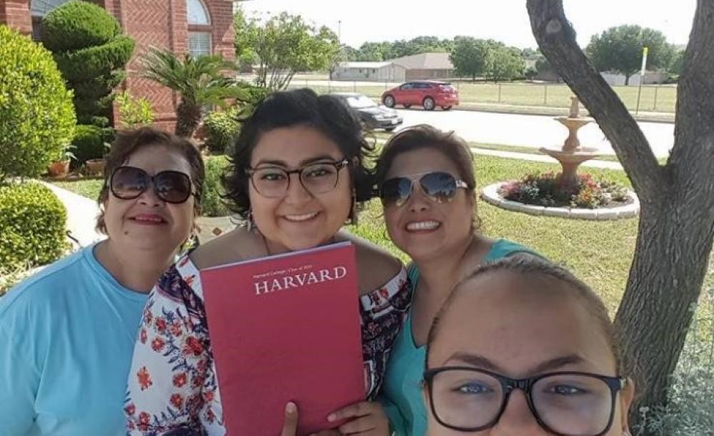 My family and I showing off my Harvard admitted student packet