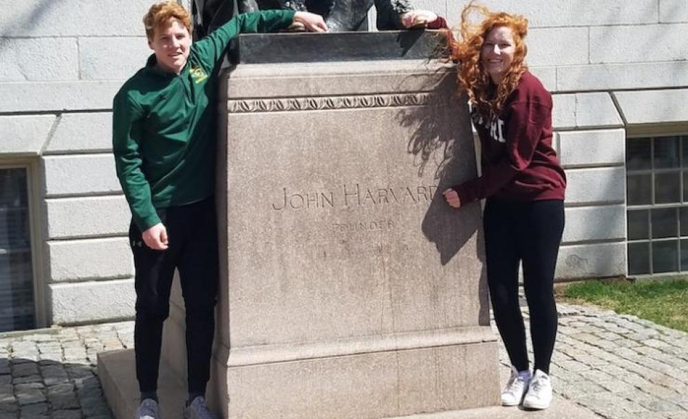 Allison and her brother with the John harvard statue