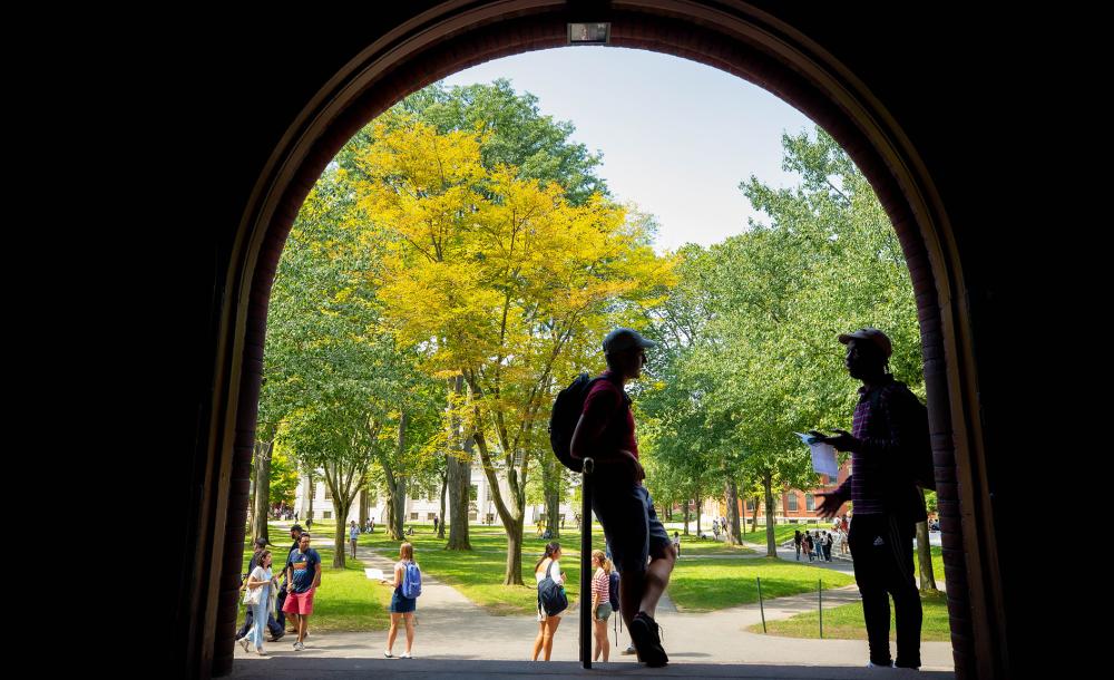 Silhouettes of students standing in doorway