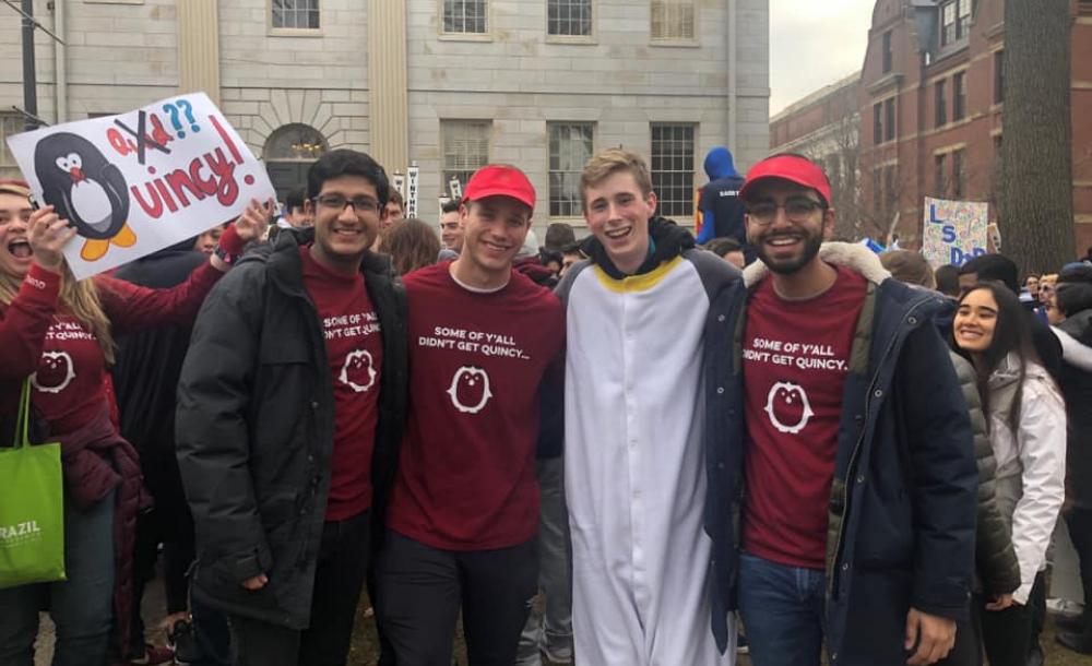A group of students wearing Quincy House attire