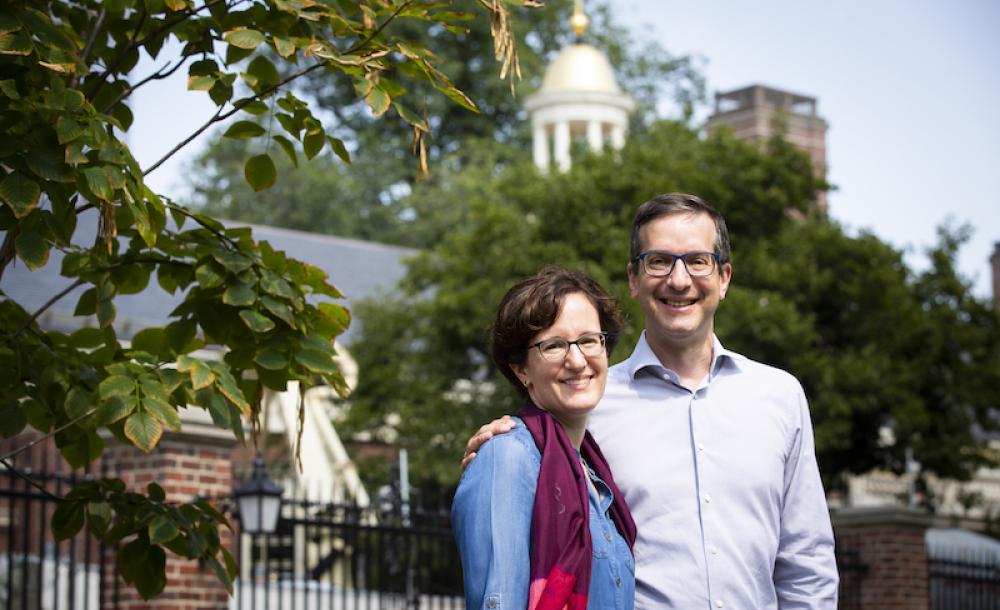 Nina Zipser and David Laibson stand in front of Lowell House