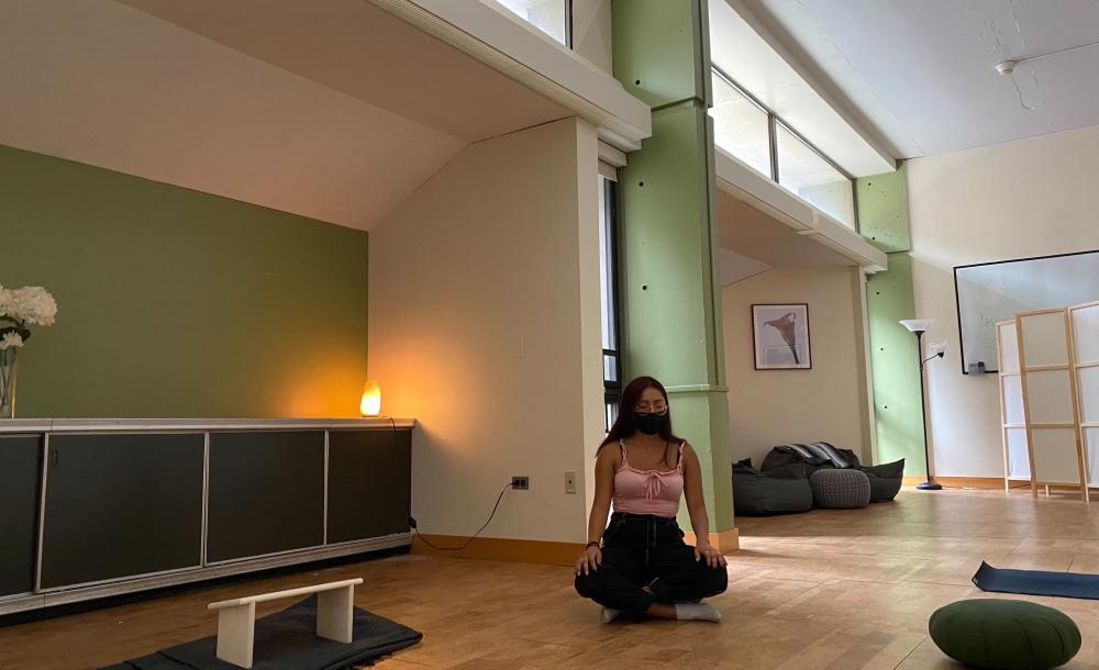 A student meditating in the Mather Tranquility Room.